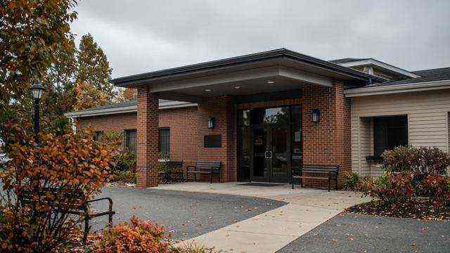 Brookletts Place senior center entrance in Easton, empty benches