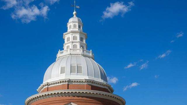 Maryland State House dome under a hard sky