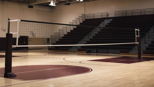 High school volleyball scoreboard showing a 1-3 home loss